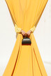 © Ulas&Merve/Stocksy - Minimalist Fashion Concept with Yellow Curtains and Handbag