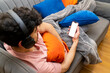 © Christine La/Stocksy - Listening to music mockup mobile phone