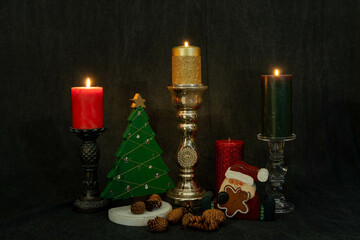 Christmas still life with candle that are lit in a Landscape Orientation