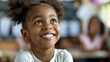 © f. - Smiling African American girl in classroom, focused on learning and enjoying the experience