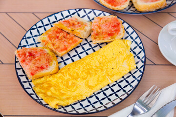 Sticker - Appetizing stuffed french omelet served with fresh baguette slices dressed with sauce