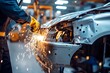 © Yurij - Expert car repair  technician welding vehicle body on stand after collision in modern workshop