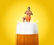 © BillionPhotos.com - Man in swimsuit floating at top of foamy beer glass