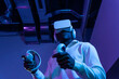 © VICTOR TORRES/Stocksy - Immersive VR gaming experience with handheld controllers