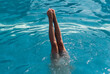 © J.R. PHOTOGRAPHY/Stocksy - Woman Doing Handstand in a Pool