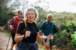 © BONNINSTUDIO/Stocksy - Senior women hiking in nature enjoying their retirement