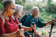 © BONNINSTUDIO/Stocksy - Senior women taking a break during hiking day
