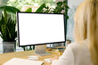 © Artem Podrez/Stocksy - Mockup woman uses a computer with white screen at office