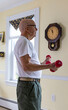© Raymond Forbes LLC/Stocksy - Active physical Senior Citizen military Veteran doing  dumbbell