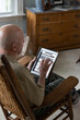 © Raymond Forbes LLC/Stocksy - Senior on ipad tablet computer Veteran Medical benefits