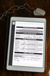 © Raymond Forbes LLC/Stocksy - Veteran Medical benefits form on tablet computer tablet