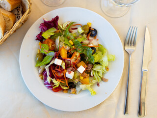 Sticker - Just cooked mediterranean salad served on table in restaurant.