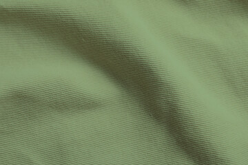 Sticker - Sage color fabric as background, top view