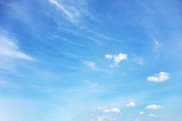Wall Mural - blue sky background and white clouds soft focus, and copy space horizontal shape.