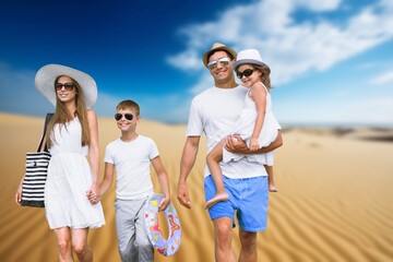 Wall Mural - Happy young family and children on the beach on vacation