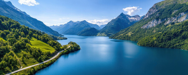 a breathtaking view of a clear blue mountain lake surrounded by lush green hills and tall mountains 