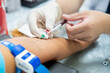 © Chutipon - Close up hand of nurse, taking blood sample from a patient in the hospital.