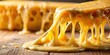 © Udomner - Close up of melted cheese being stretched and pulled with a gooey texture, cheese, pull, melted, stretch, gooey, food, dairy