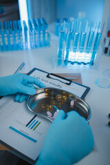 Wall Mural - a scientist is testing various pills in order to improve their quality an effectiveness in the labor