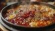 © Nuttaya Nampai - A detailed shot of a Chongqing butter hot pot with red chili oil, peppercorns, and sizzling meats, emphasizing the heat and flavor of this popular Chinese cuisine