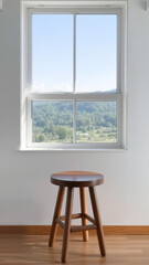 Canvas Print - Wooden Stool in Front of a Window with a View