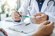 © Vooglo.com - A doctor in a white coat and stethoscope giving a strip of green medicine pills to a patient's hands
