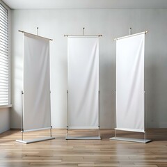 Wall Mural - Three blank roll up banners stand ready for your design.