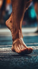 Poster - Close-up of a man's bare foot walking on a paved surface, showcasing the intricate details of the foot and ankle.