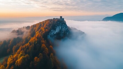 Sticker - A castle sits on top of a mountain surrounded by fog, AI