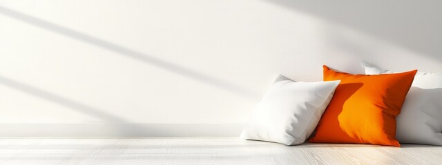 Wall Mural -  Two pillows stacked on a hardwood floor beside a white wall