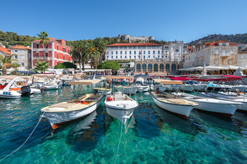 Poster - Hvar Island, Croatia. View of the old town with moored boats in the harbor. 