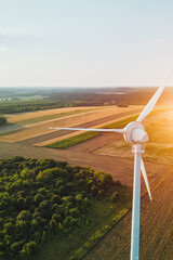 Wind turbine in countryside with evening shadows