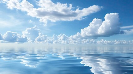 Wall Mural - A serene seascape with calm blue waters and fluffy white clouds reflecting in gentle waves.