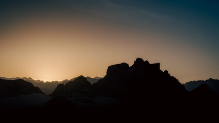 Wall Mural - sunset with blue sky and clouds in the mountains in the desert of Egypt