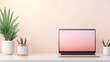© Preeyanuch - Minimalist workspace with a laptop, plant, and stationery on a white desk against a light peach background.