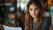 © Morng - Hispanic young woman happily collaborating with colleagues around a conference table, sharing ideas and laughing