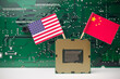 © pla2na - CPU (central processing unit) USA and Chinese flag with circuit board background. US vs China chip war or tech war, semiconductor industrial concept. US restrict and control chip export to China.
