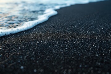 Wall Mural - Foamy wave on black sand