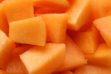 Poster - Pieces of Cantaloupe melon as background, top view