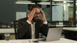 © Yuliia - Upset worried shocked frustrated Indian businessman read terrible information problem trouble error unsaved report on laptop computer in office lost failure sad business man stressed reading bad news