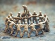 © Amigos.Flipado - A group of miniature people pulling a rope together.