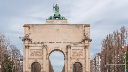 Sticker - The Siegestor or Victory Gate in Munich is a memorial arch, crowned with a statue of Bavaria with a lion quadriga timelapse. Traffic on the street around the monument. Back view. Germany