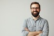 © Anna - Smiling bearded man in casual shirt with arms crossed