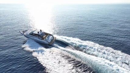 Wall Mural - Aerial view of a yacht sailing at full speed