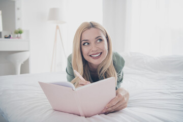 Poster - Photo of pretty young woman notepad pen contemplate silky pajama white interior bedroom apartment indoors