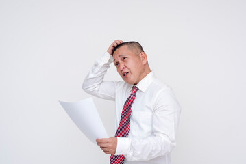 A middle-aged office professional panicking after reading a court order or lawsuit on a piece of paper. Isolated on a white background.