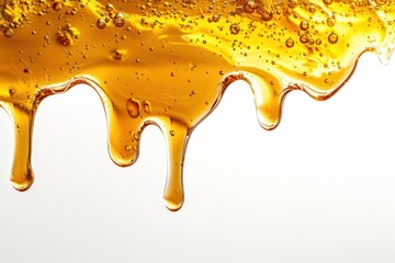 Wall Mural - Golden honey dripping with bubbles