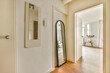 © ADDICTIVE STOCK - Interior view of a modern home with hallway and mirror