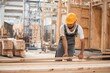 © standret - Contractor is busy. Industrial worker in wooden warehouse