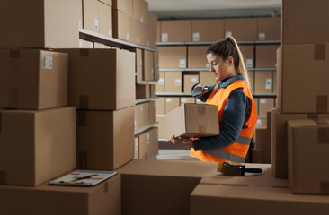 Warehouse stocker scanning a barcode on a box